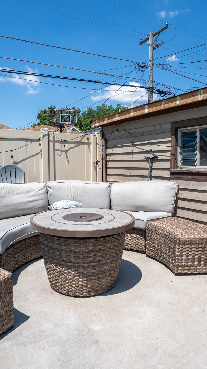 Vertical-format crop of a ground-level HDR patio photo, reframed for social