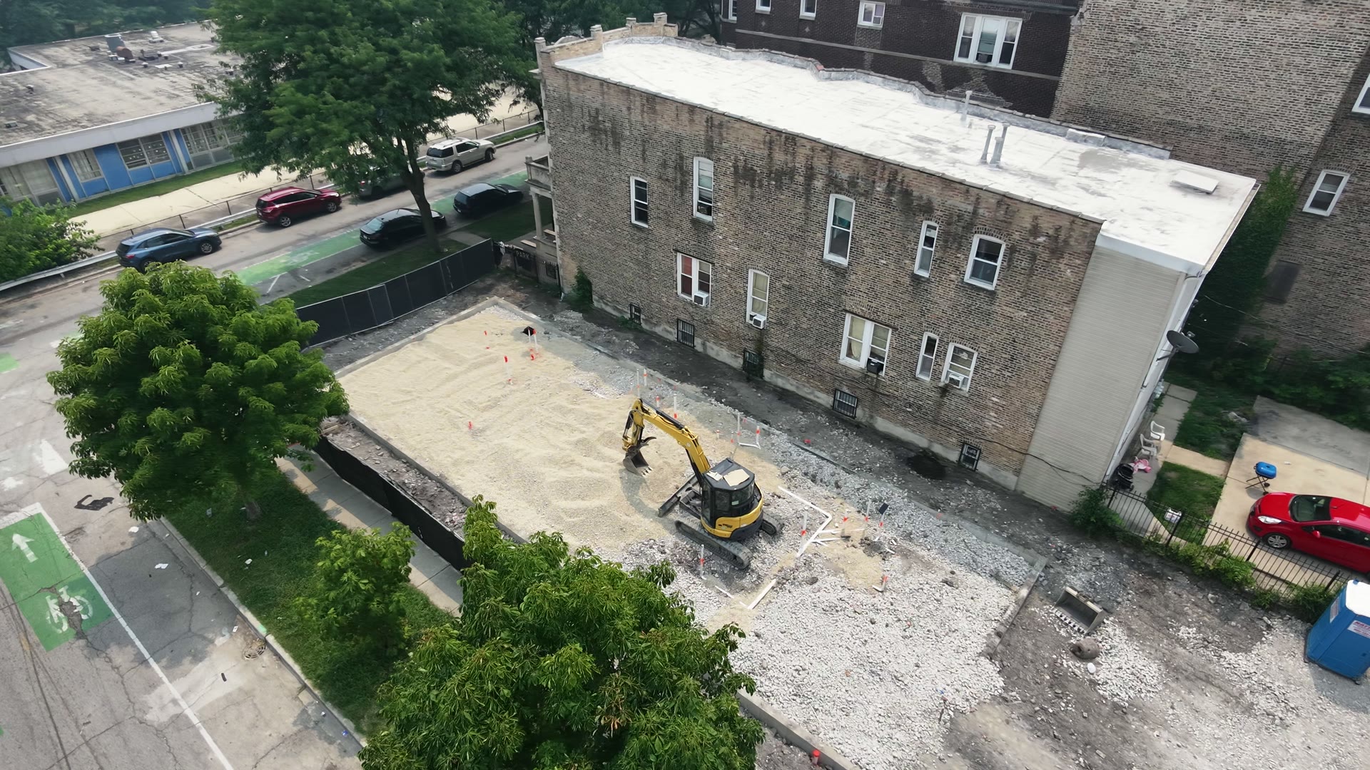 Aerial view of a brick multi-unit building under construction — video thumbnail