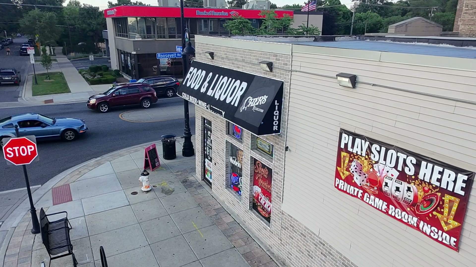 Aerial flyover of a commercial corner storefront, third angle — video thumbnail